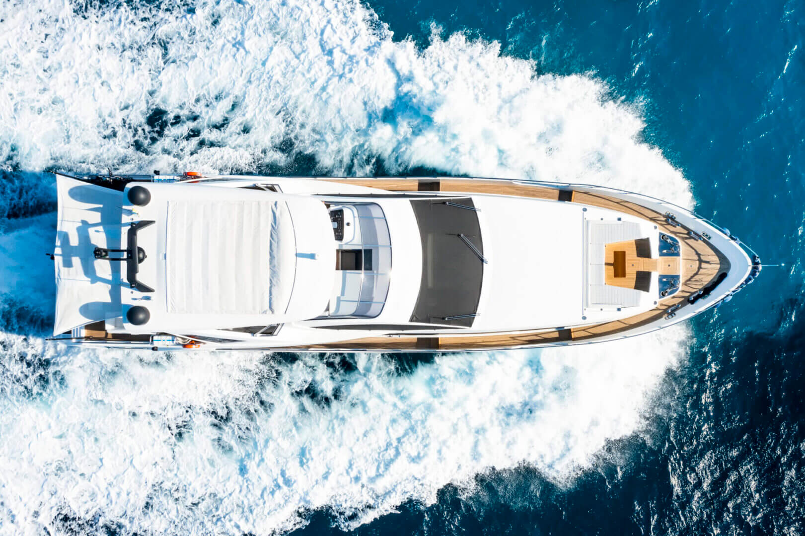 Top-down view of luxury yacht wake